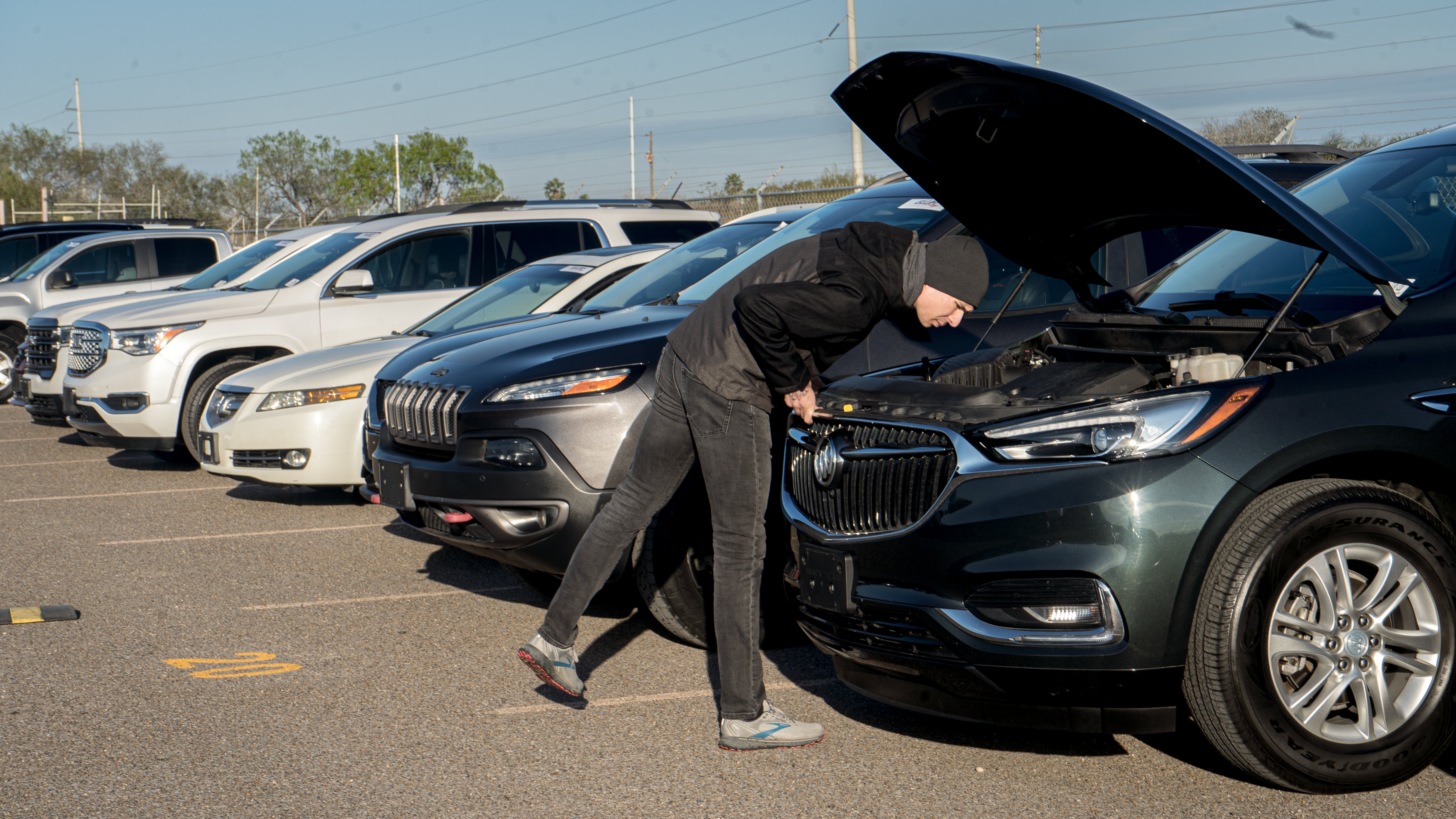 Dealer Inspecting A Vehicle During Big Valley Auto Auctions Preview Day